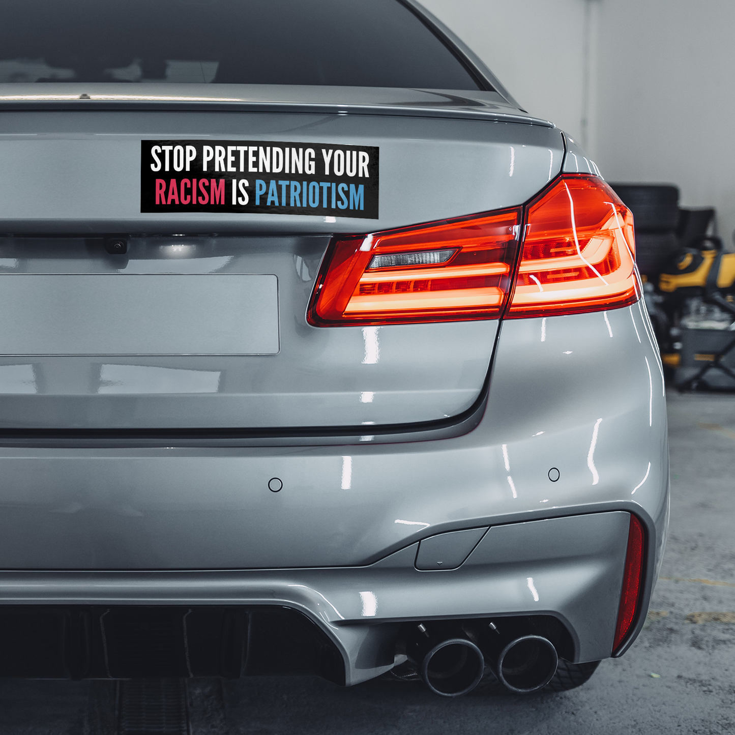 Stop_Pretending_Your_Racism_is_Patriotis_WhiteBumperSticker-GrayCar_Mockup.png