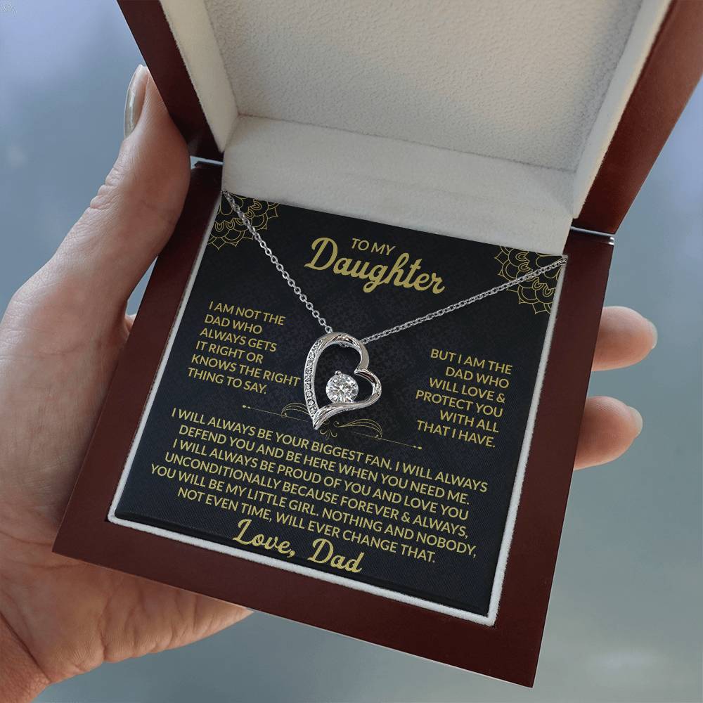 Emotional silver daughter necklace gift presented in red box with heartfelt message card, held outdoors for a natural, real-life feel