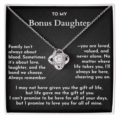 Necklace with a heart-shaped pendant on a card for a bonus daughter, featuring sentimental text.