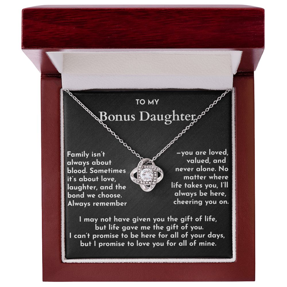 Necklace in a wooden box with a message for a bonus daughter