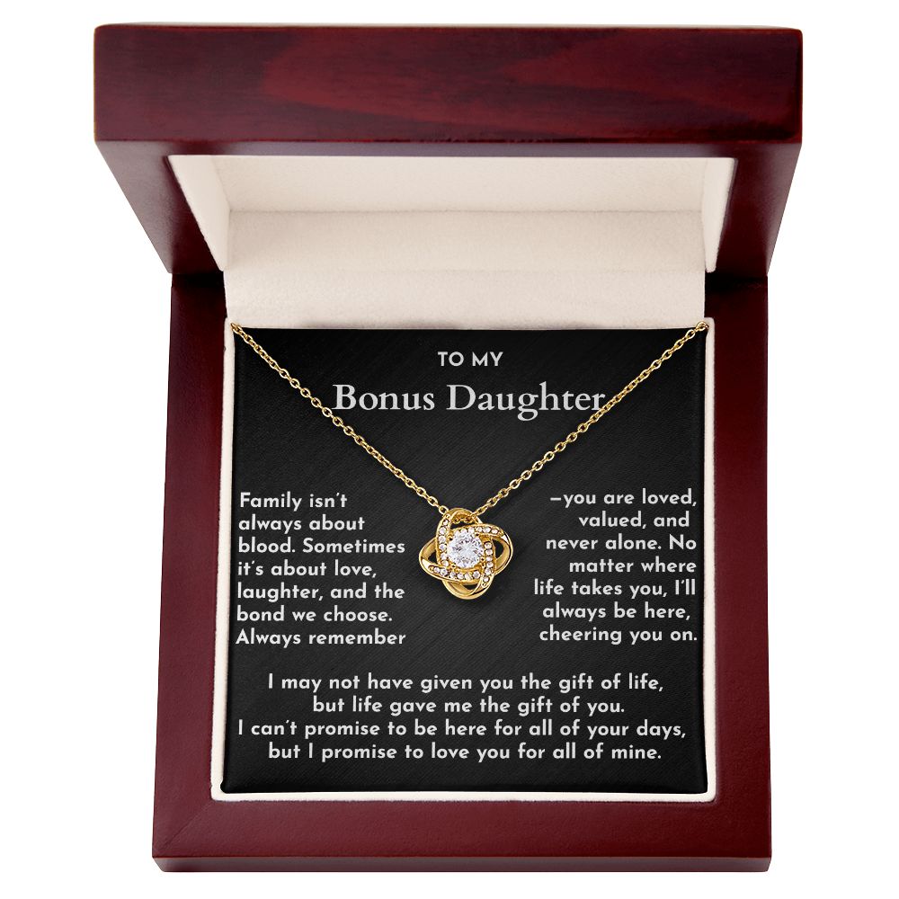 Gold necklace in a wooden box with a message card for a bonus daughter.