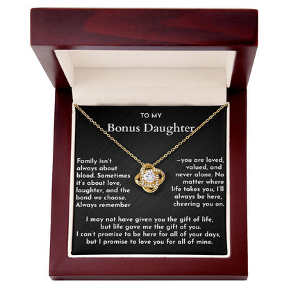Gold necklace in a wooden box with a message card for a bonus daughter.