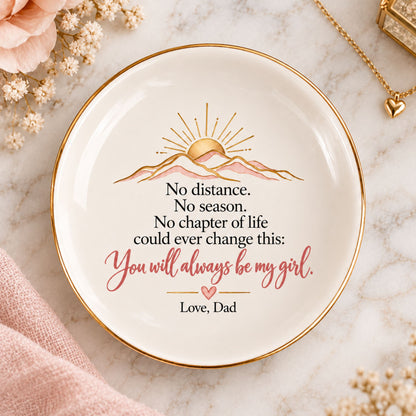 Round white ceramic trinket dish with gold rim, blush and gold sunrise illustration, and a loving message from Dad to daughter.
 Copy alt text