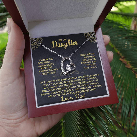 Emotional silver daughter necklace gift presented in red box with heartfelt message card, held outdoors for a natural, real-life feel